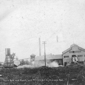 Multistory building with water tower and power line