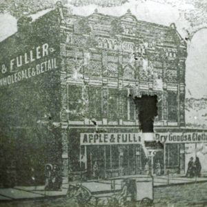 Multistory building with covered porch on street