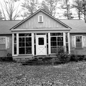 Single-story house with glassed-in front porch