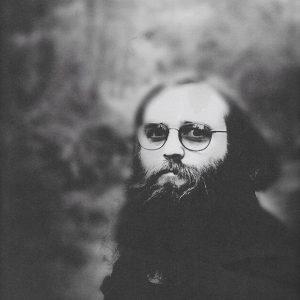 Young white man with glasses and long beard