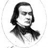 White man with long hair in suit and bow tie