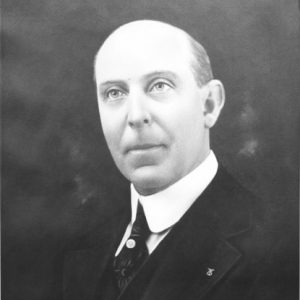 Bald white man in suit and tie