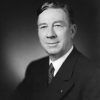 White man in suit and spotted tie