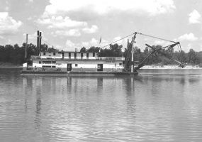 Steamboat with dredge device hanging from its stern