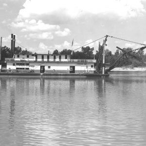 Steamboat with dredge device hanging from its stern