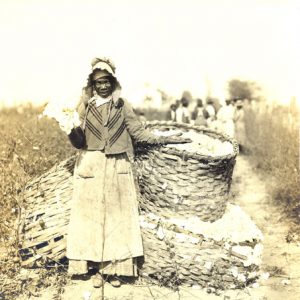 African-American woman with baskets filled with cotton