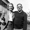 white man and woman standing outside