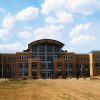 multi-story brick, steel, and glass building