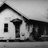 rough wooden A-frame building labeled "Bearden"