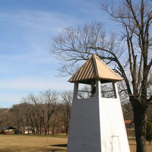 narrow pyramid-shaped bell tower open near the top