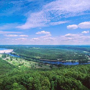 elevated view of sharply curving river and dam