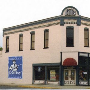 "D and R Hobbs" named brick building with first floor "Daisy Airgun Museum"