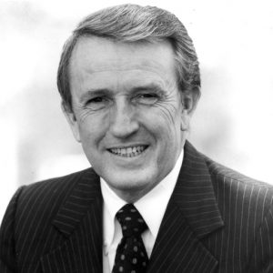 Portrait of white man in suit and tie