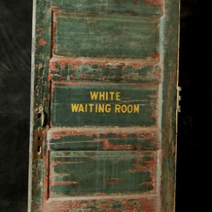 old green door with yellow lettering "White Waiting Room"