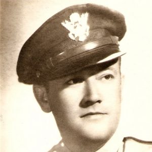 White man in military uniform with cap