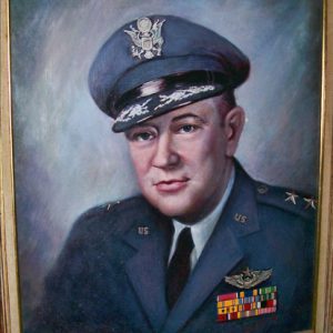 White man in military uniform with cap inside gold frame