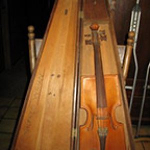 Violin with square shaped shoulders and chin rest in wooden case