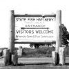 Sign with wooden posts for the "State Fish Hatchery"