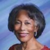 Older African-American woman smiling in red dress