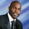 African-American man smiling in suit and tie