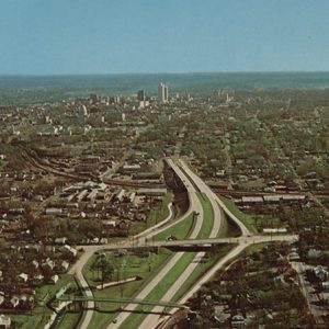 Multilane interstate highway and city as seen from above