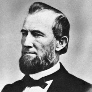 White man with beard in suit and bow tie