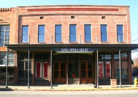 two-story brick building labeled, "King Opera House"