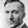 Portrait young white man in suit bow tie combed short sided haircut