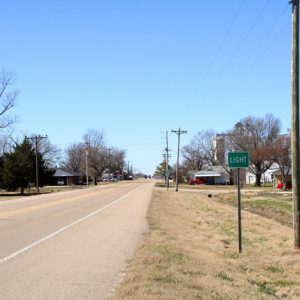 two lane road with sign "Light"