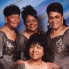 Four African-American women in matching dresses