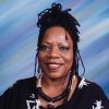 African-American woman with necklace in dress