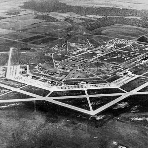 aerial view of buildings and paved runways