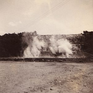 clouds of smoke or dust in field