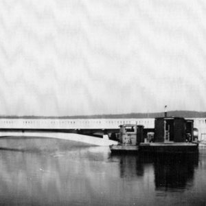 bridge spanning across flooded lake