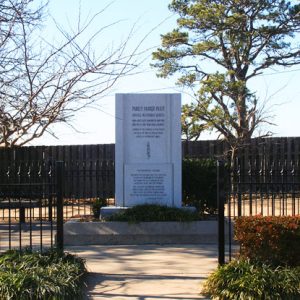 white rectangular stone with "Parley Parker Pratt" at top surrounded by black iron fence