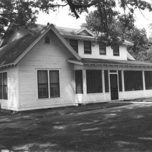 Two-story house with closed-in porch