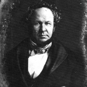 White man in suit and cravat