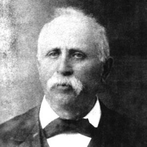 Portrait white man in suit and bow tie with mustache