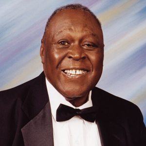 African-American man smiling in tuxedo