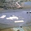 Dirt road leading to missile base surrounded by a fence