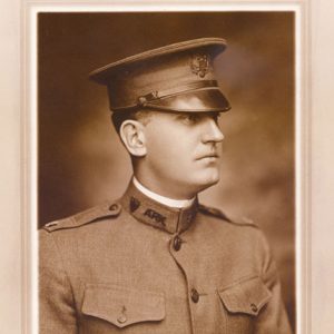 Profile view of white man in military uniform with cap