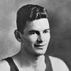 Young white man smiling in dark tank top