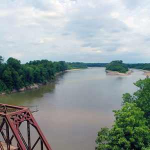 River as seen from above steel truss bridge