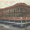 Corner view of multistory red brick building