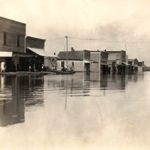 Storefront buildings with street filled with water