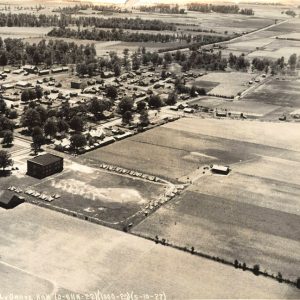 Aerial view of tents amid field near small town