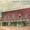 Two story red brick building with sign saying "Sellmeyer Mercantile  Company"