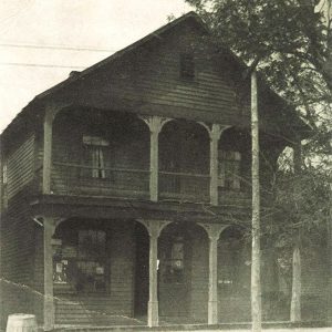 Two story wooden house with balcony