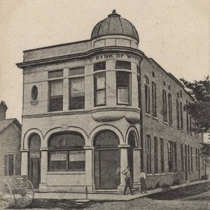 Two story building with cupola over the entrance