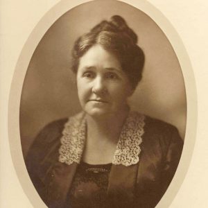 Older white woman in formal sitting